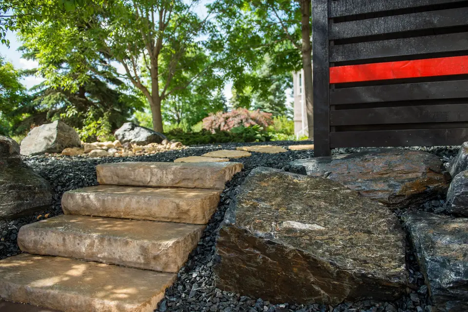 Natural stone steps between large boulders